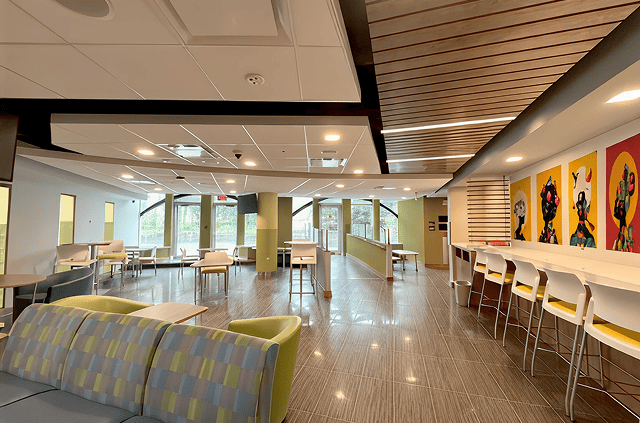 BSI Lounge interior showing modern seating area with tables and chairs